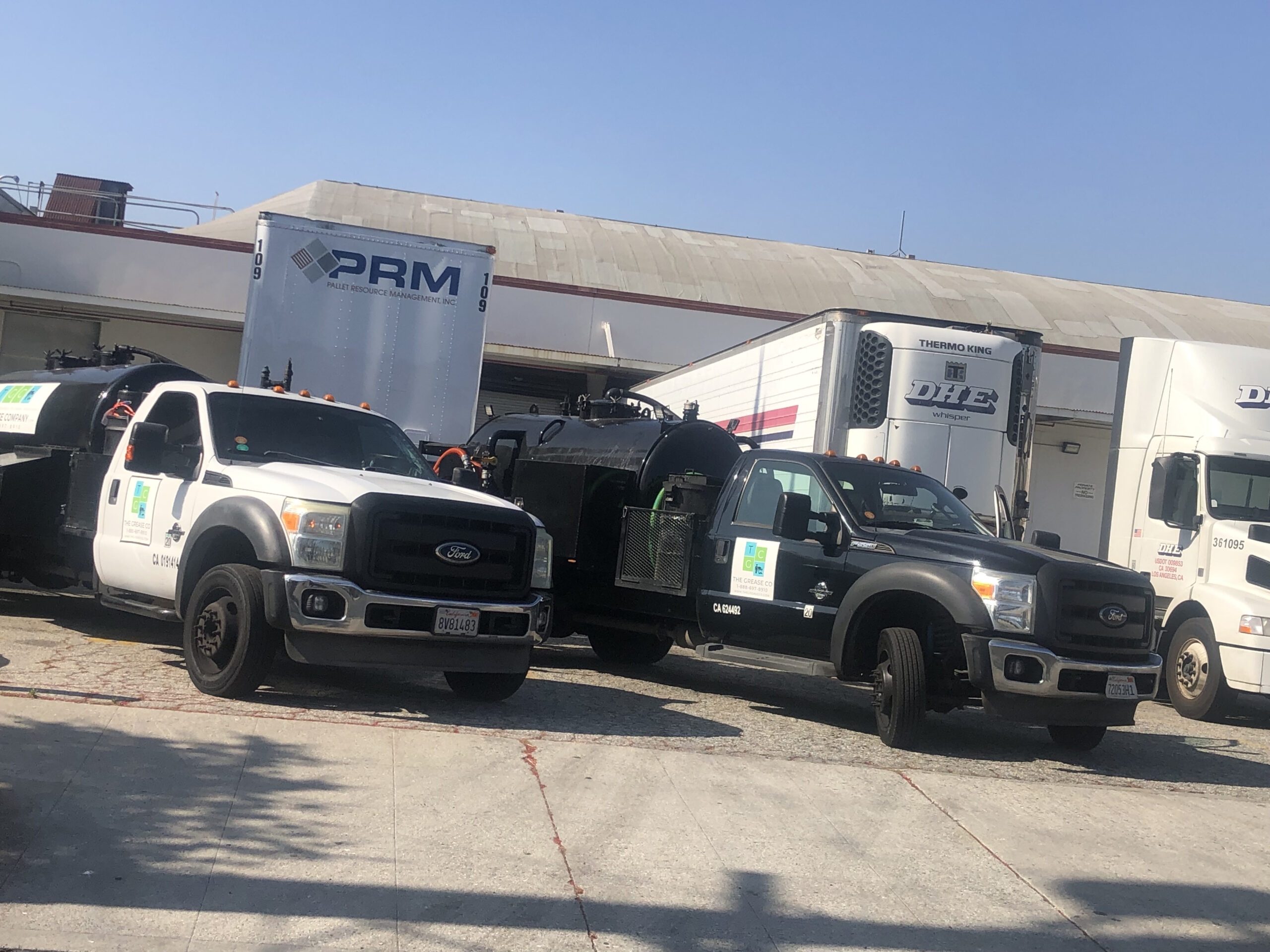 Los Angeles Grease Company service truck parked in front of a restaurant in LA County