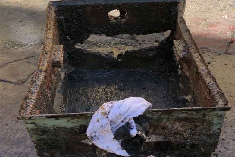 A heavily corroded grease trap requiring extensive grease trap repair and a complete structural assessment.