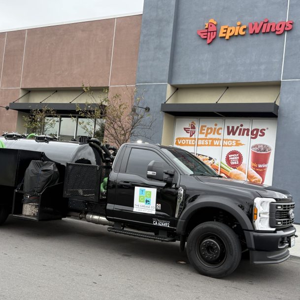 Grease trap cleaning truck outside a Los Angeles restaurant